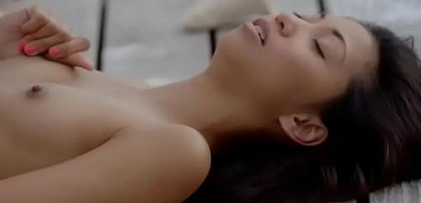  Asian angel undressing by the ocean